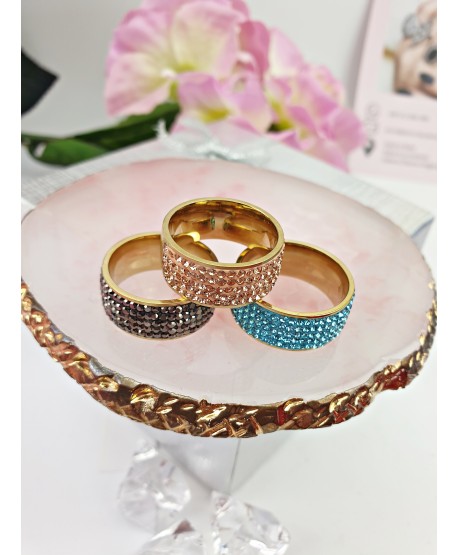 Pierścionek stal złoty z niebieskimi dżetami