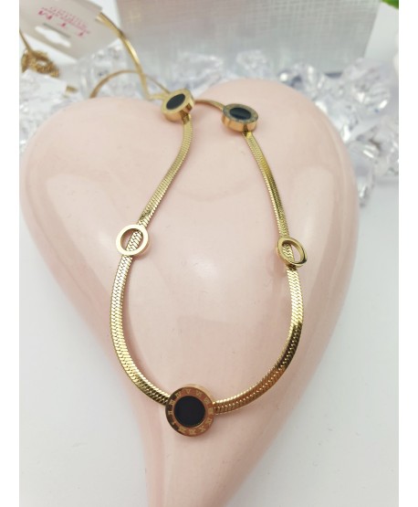 Naszyjnik stal złoty z czarnymi kółeczkami