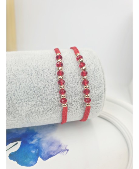Bransoletka z czerwonymi kryształkami i złotymi kuleczkami