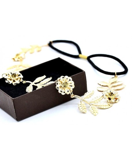 Opaska na gumce ze złotym kwiatowym motywem