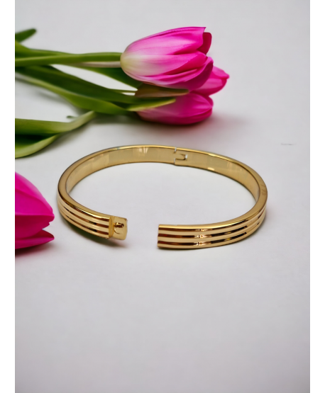 Bransoletka stal złota sztywna z paseczkami