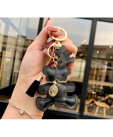 Breloczek krateczkowy miś z dowieszkami czarny