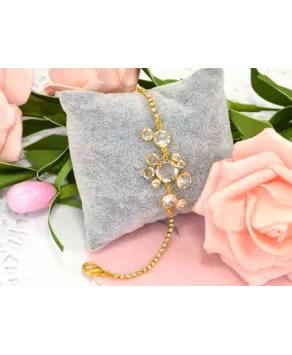 Bransoletka przezroczyste kryształki w złotej oprawie w różnych wzorach