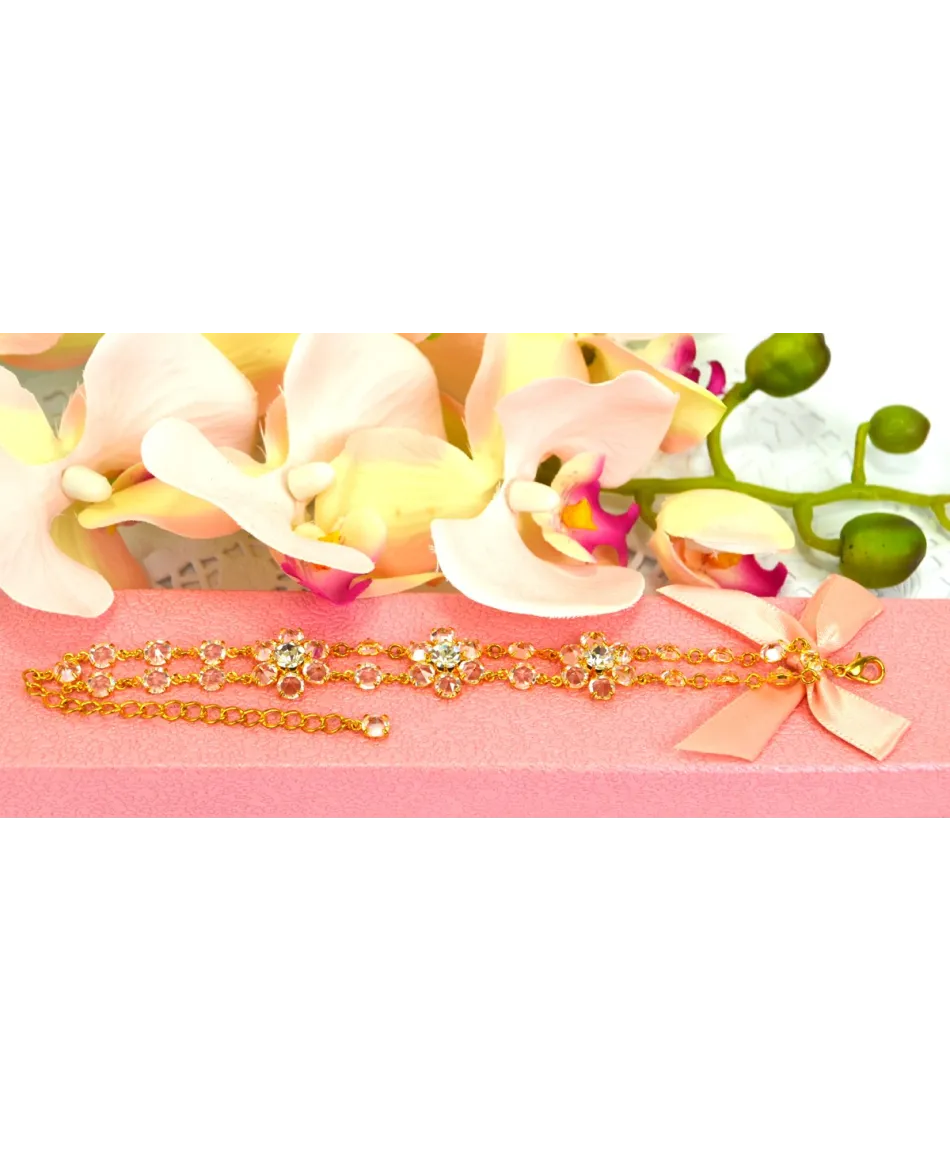 Bransoletka przezroczyste kryształki w złotej oprawie w kwiatowych wzorach