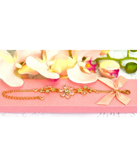 Bransoletka przezroczyste kryształki w złotej oprawie w kwiatowych wzorach